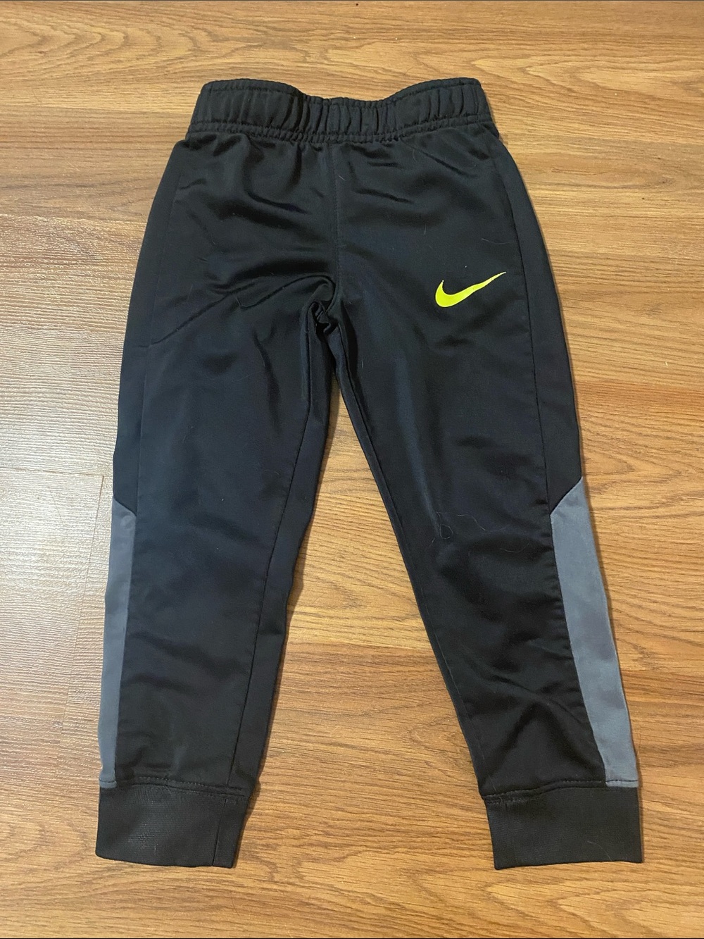 ✨8/$10. Nike Black Joggers with Neon Yellow Swoosh and Gray Panels. Size XS